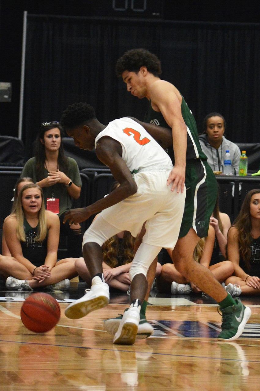 Junior guard Christian Shaneyfelt forces Blanche Ely senior guard Daniel Merrius to lose control of the ball.