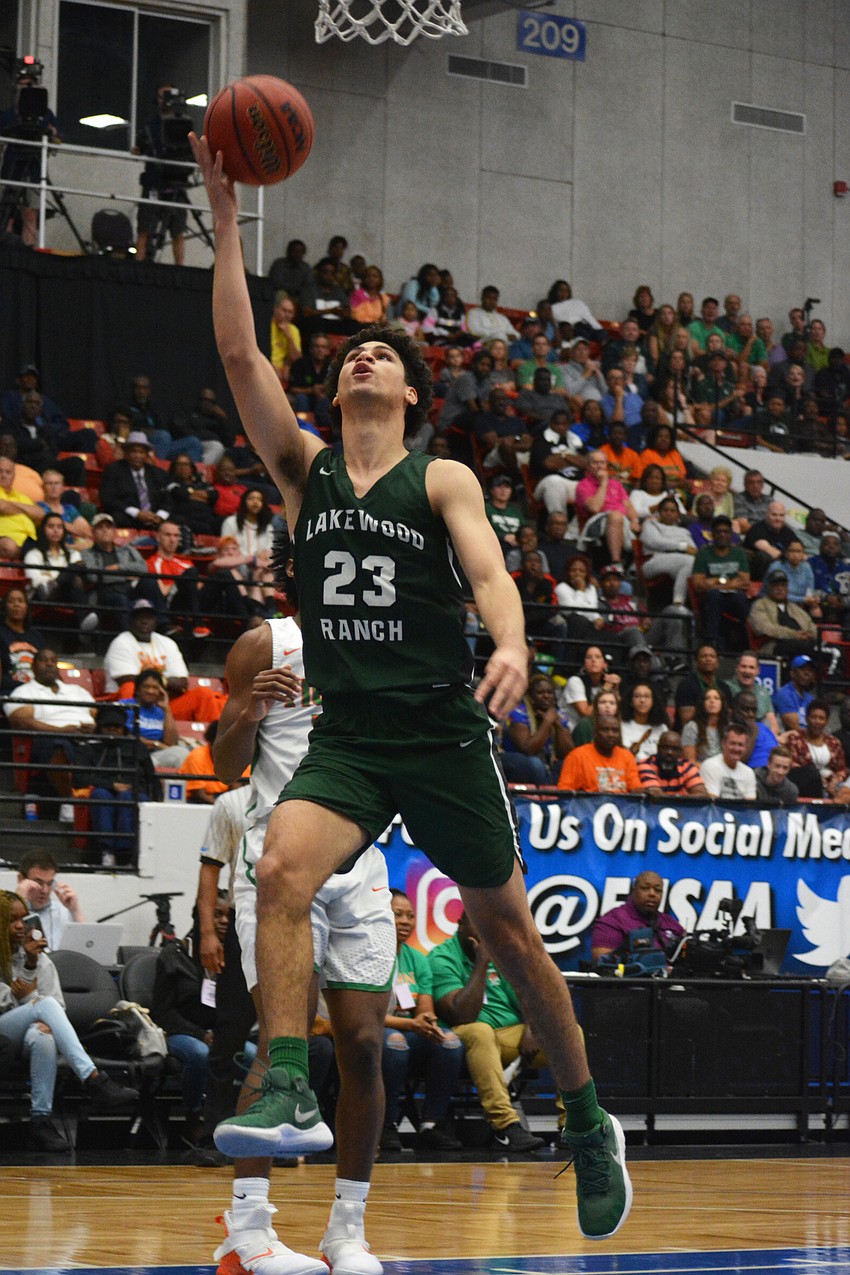 Junior guard Christian Shaneyfelt sinks an uncontested layup against Blanche Ely.