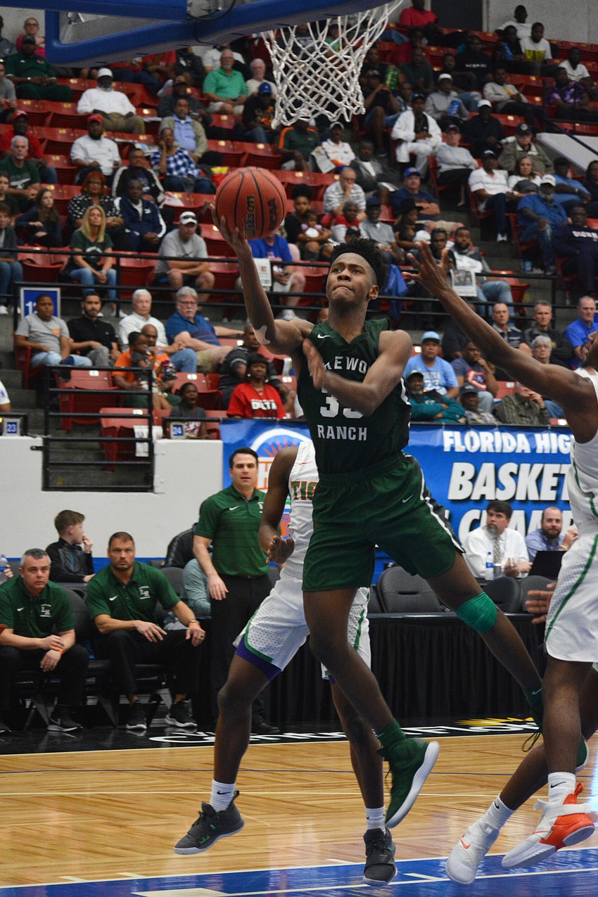 Senior forward Josh Young hits a layup against Blanche Ely.