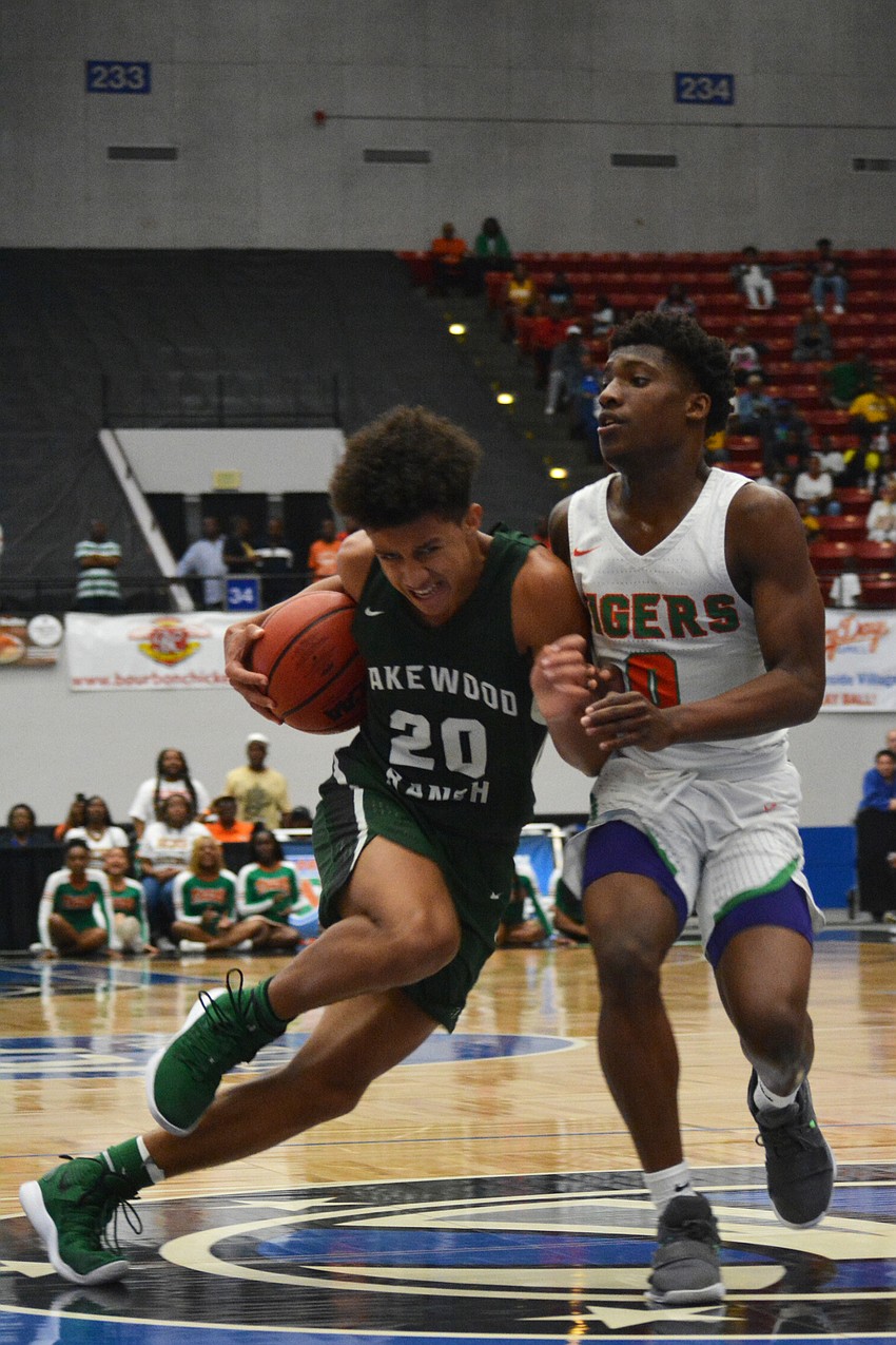 Junior guard Keon Buckley battles Blanche Ely junior guard Tyrecke Francois to get to the hoop.