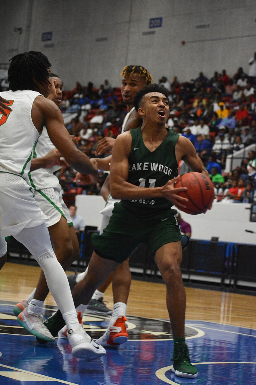 Senior guard Lantz Barton gets fouled by Blanche Ely in the lane. He finished with four points.