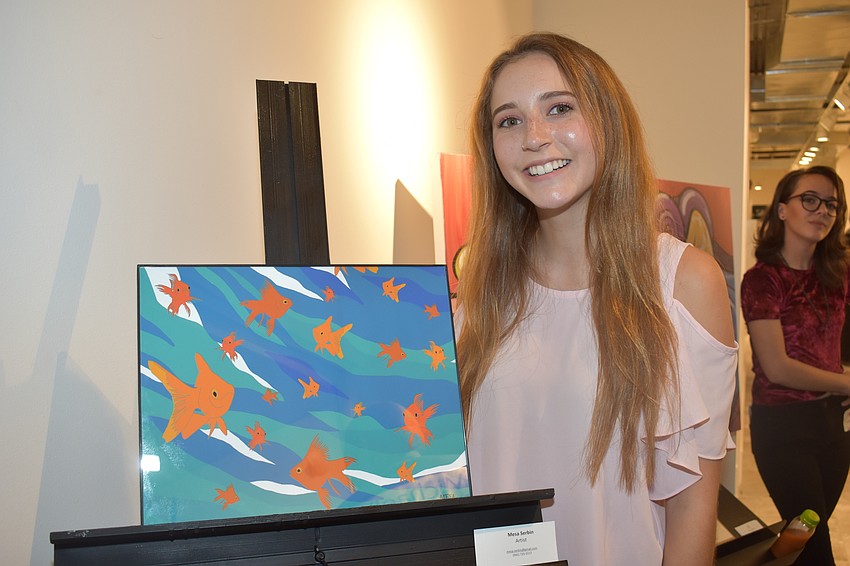 Mesa Serbin, a student at Booker High School in the Visual Performing Arts program, auctioned off her painting.