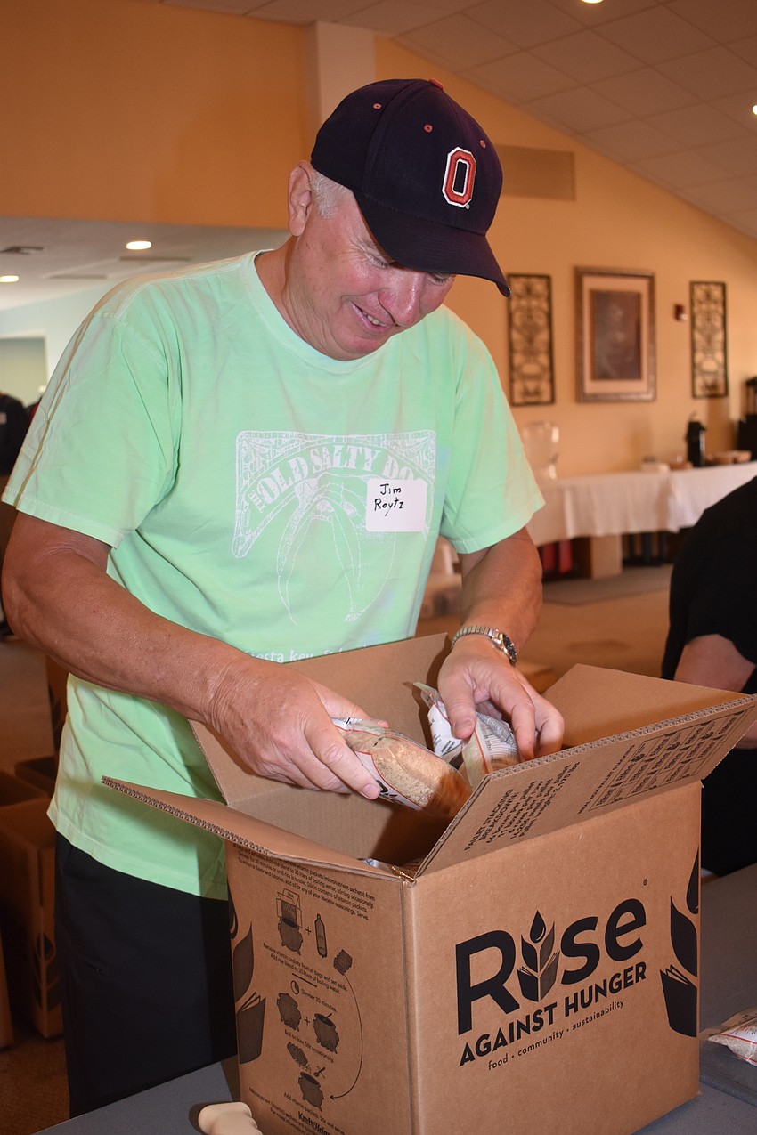 Jim Roytz packs the boxes before they are sealed.