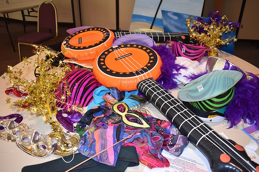 People used photo booth props at the carnival.