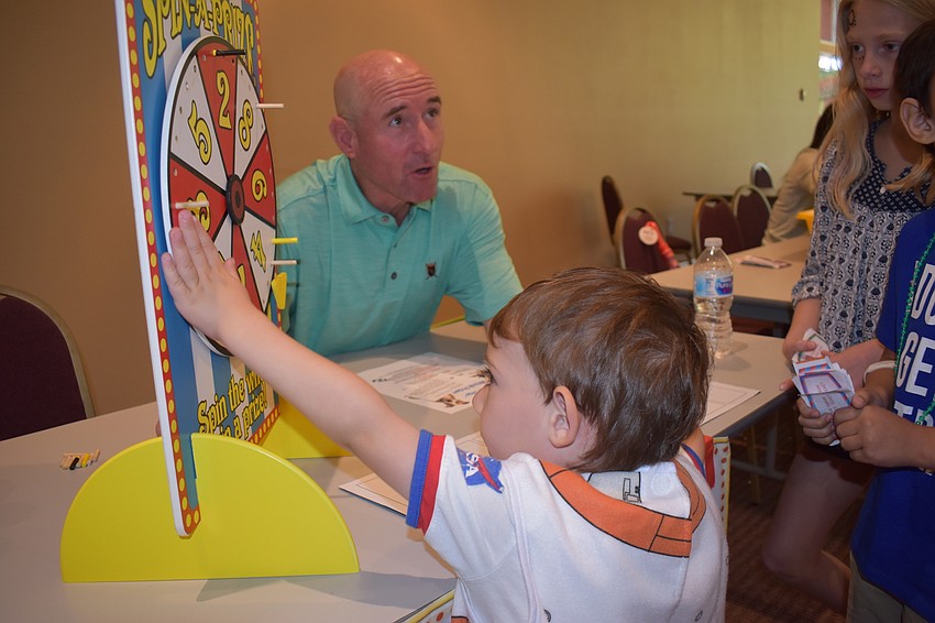 Carnival games, like this spinning wheel, were used to entertain families.