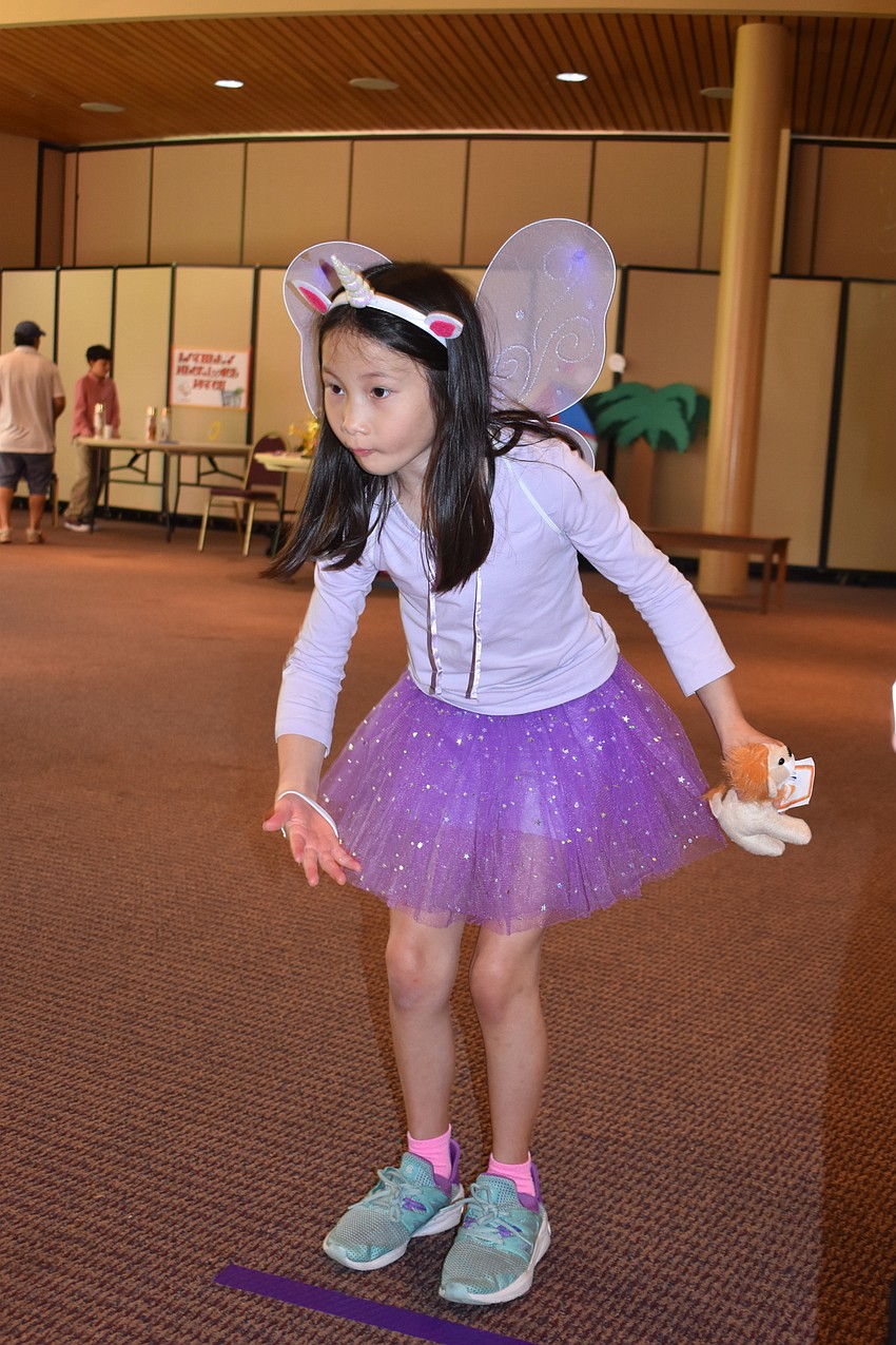 Zadie Jacobs-Carlson played bean bag toss at the carnival.