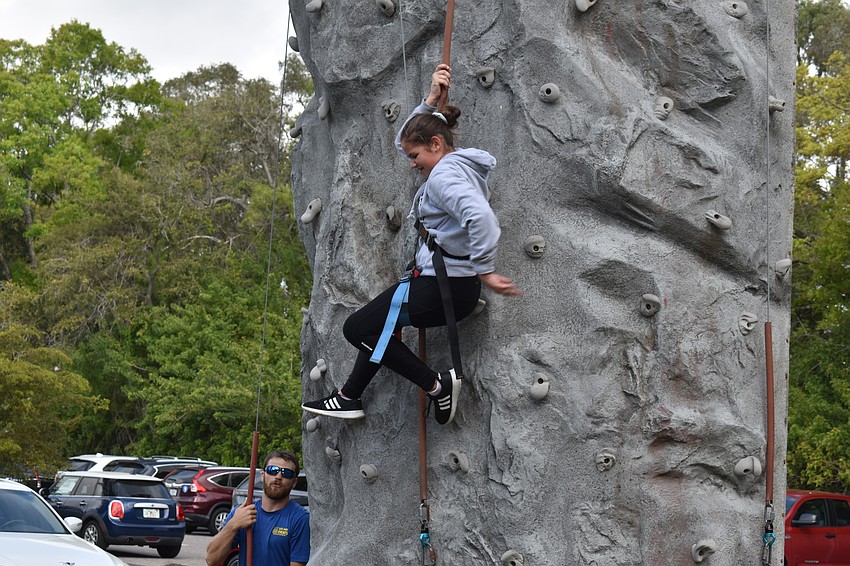 Alexandra Witherspoon repels off of the climbing wall.