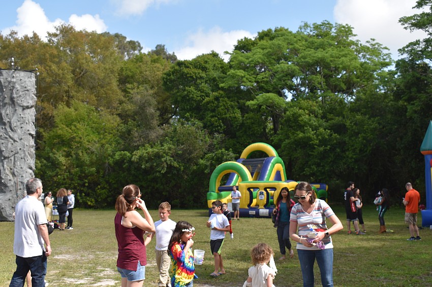 The carnival included bouncy castles and a rock wall.