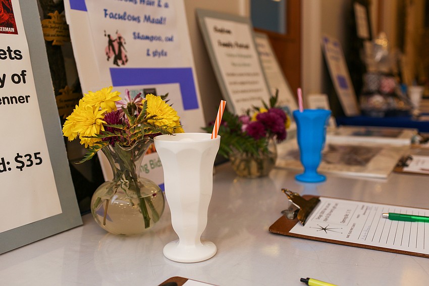 Milkshake cups decorated the silent auction table.