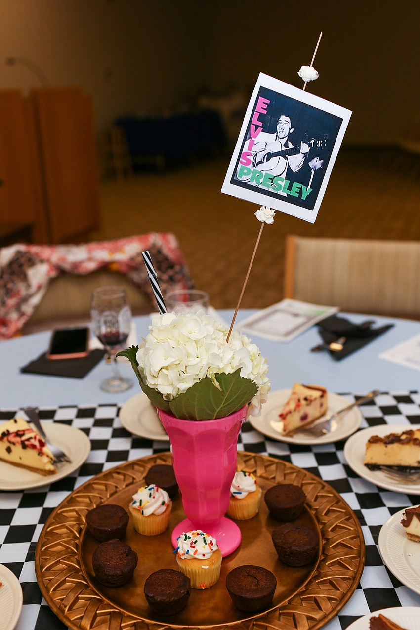50s singers and milkshake cups adorned the tables.