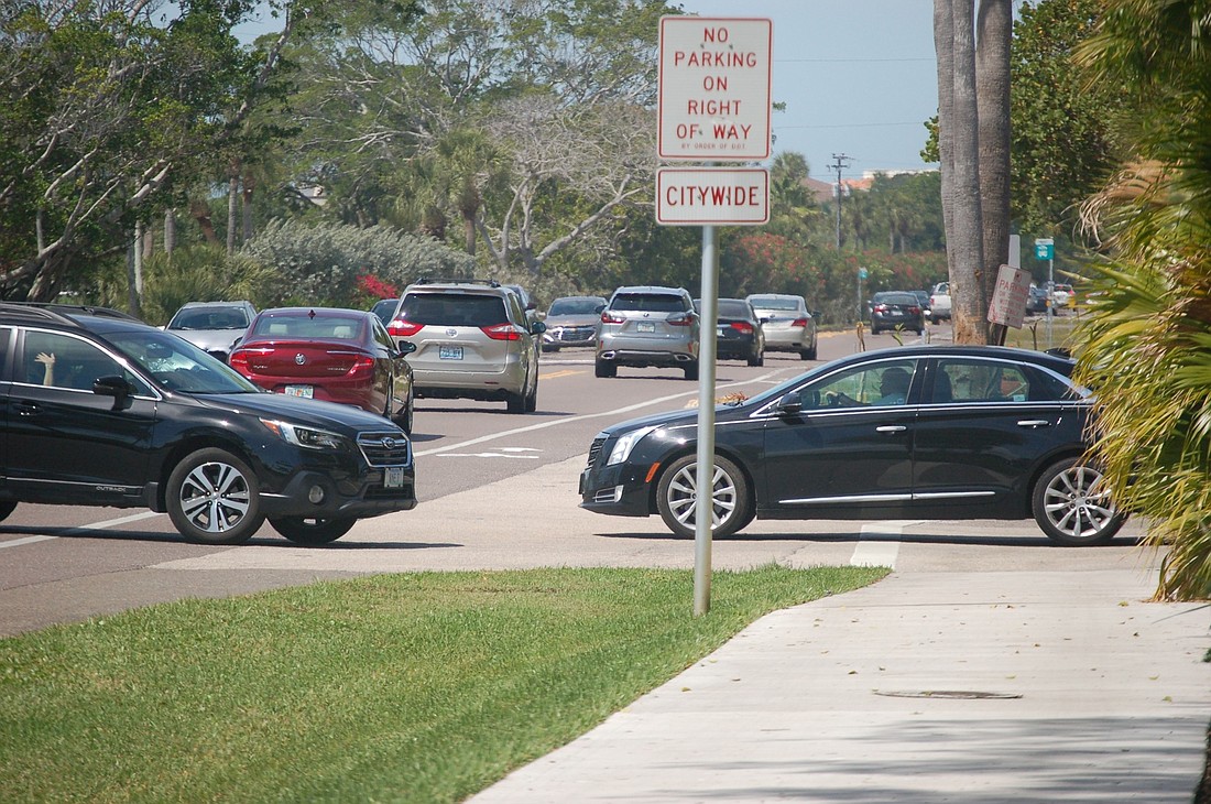 Traffic leaving to the south from Tangerine Bay and other communities and businesses along Gulf of Mexico Drive often must contend with an unbroken line of cars in both directions.