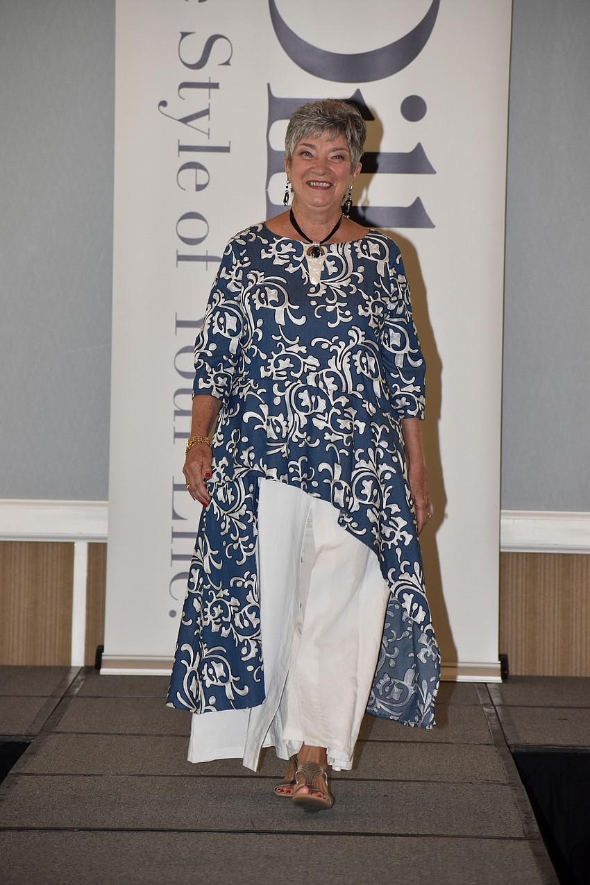 Mary Del Pup models a Niche Pacific tunic. The fashion show took place on Del Pup’s birthday, so the crowd sang to her before the show.
