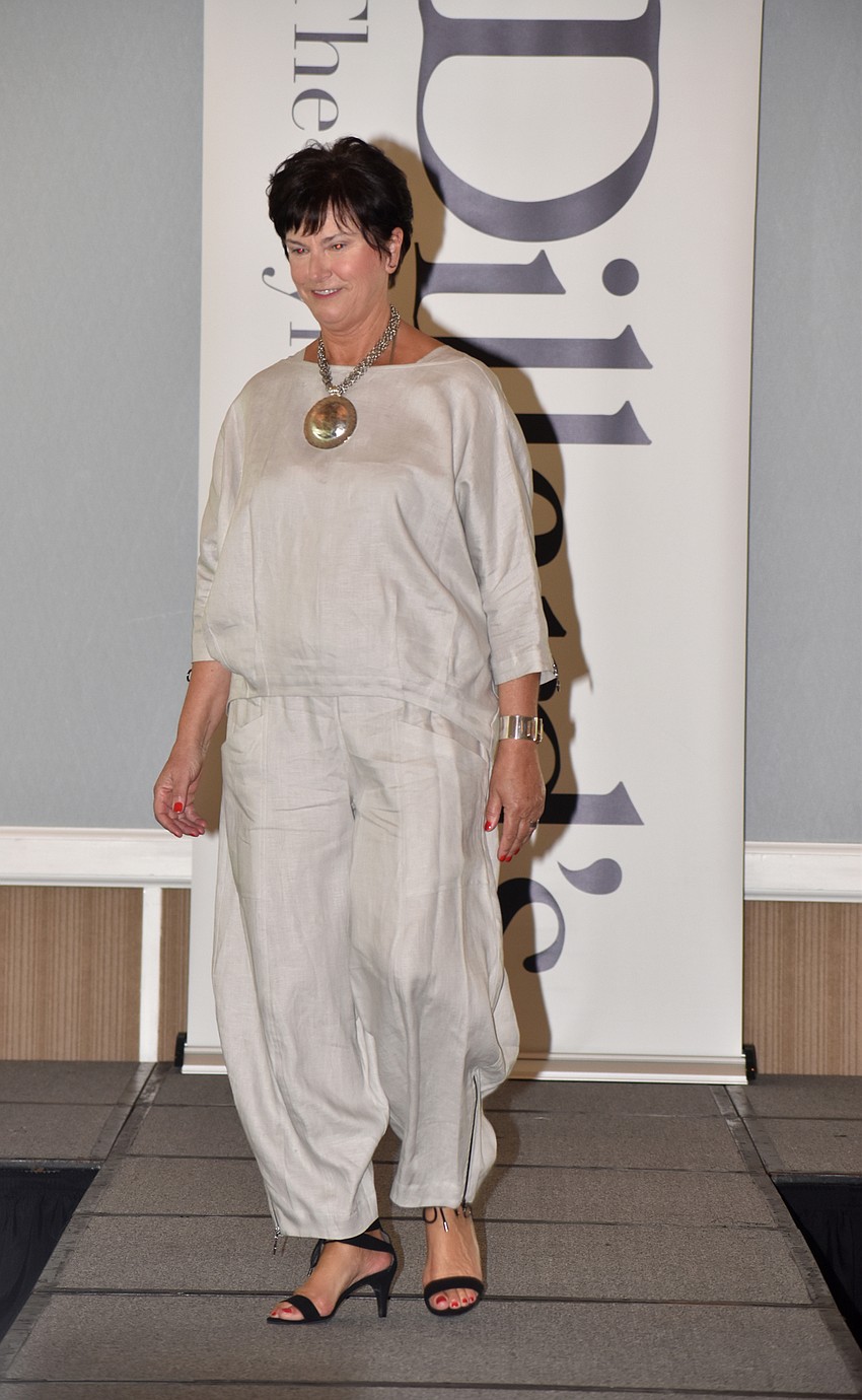 Catherine Costello models a gray linen top during the fashion show, which featured clothes from Dillard’s.