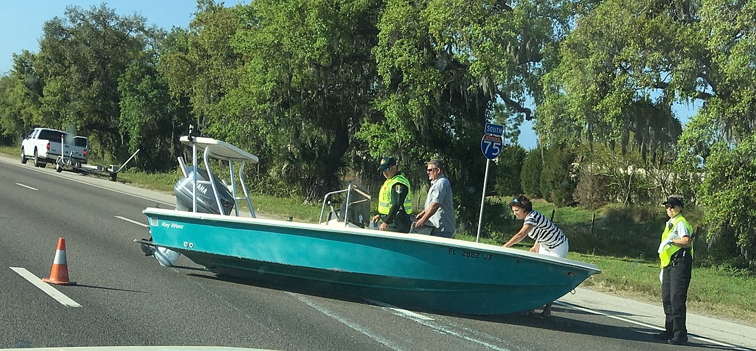 A boat being towed by a pickup truck came to rest in the southbound travel lanes of Interstate 75. (Courtesy photo)