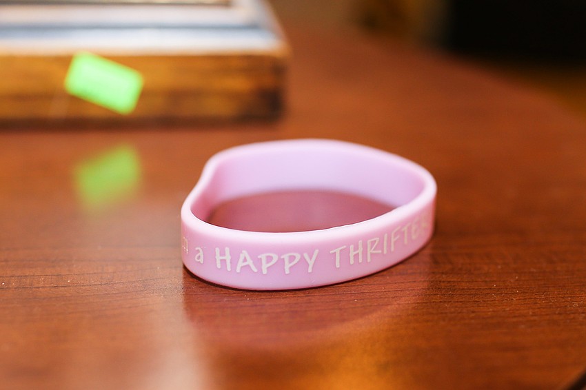 Retail queens and kings receive a bracelet when they get on the bus.