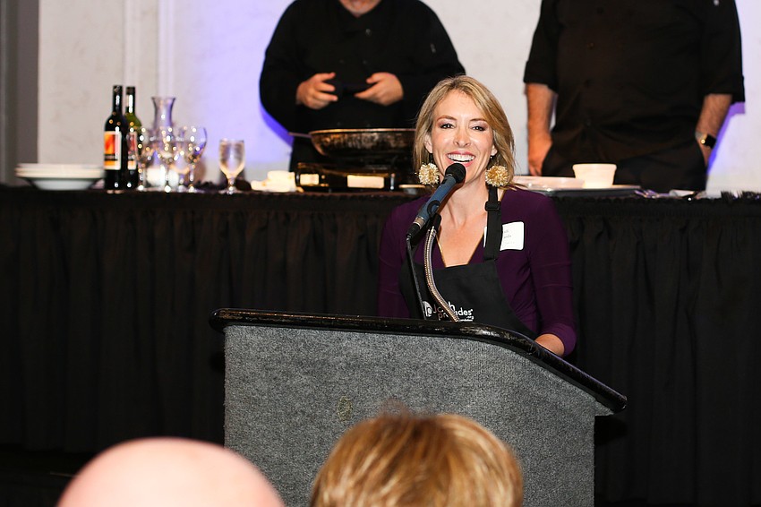 Cyndi Edwards welcomes guests to the dinner.