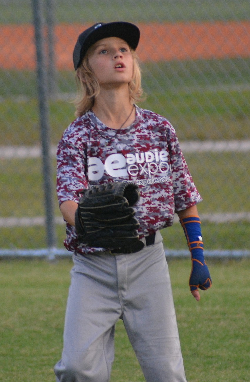 When playing the outfield, first base or catcher, Landon Marazon wears a glove on his right hand and then tucks it under his left arm so he can make a throw.
