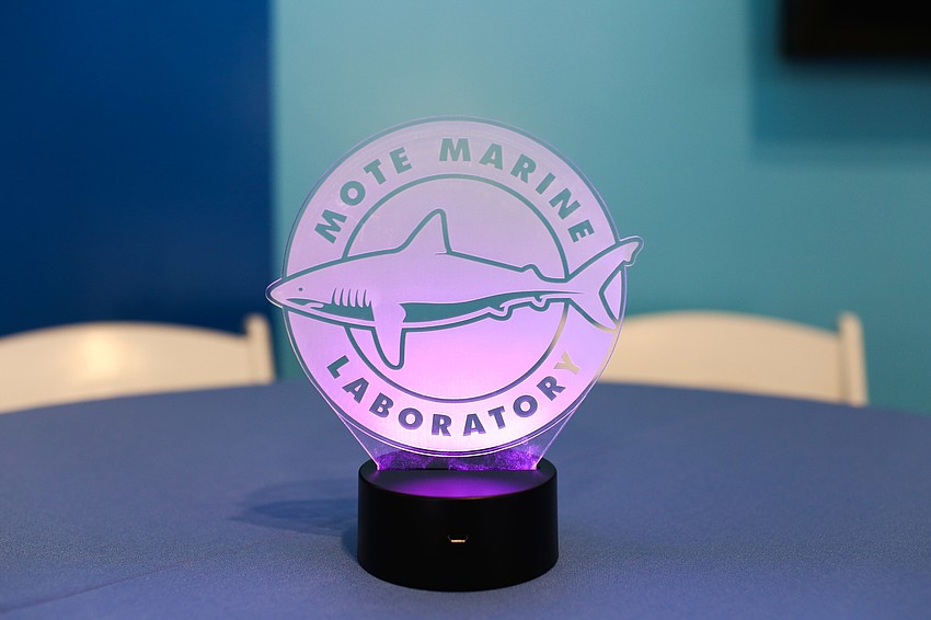 Light up signs and pineapples decorated the cocktail tables.