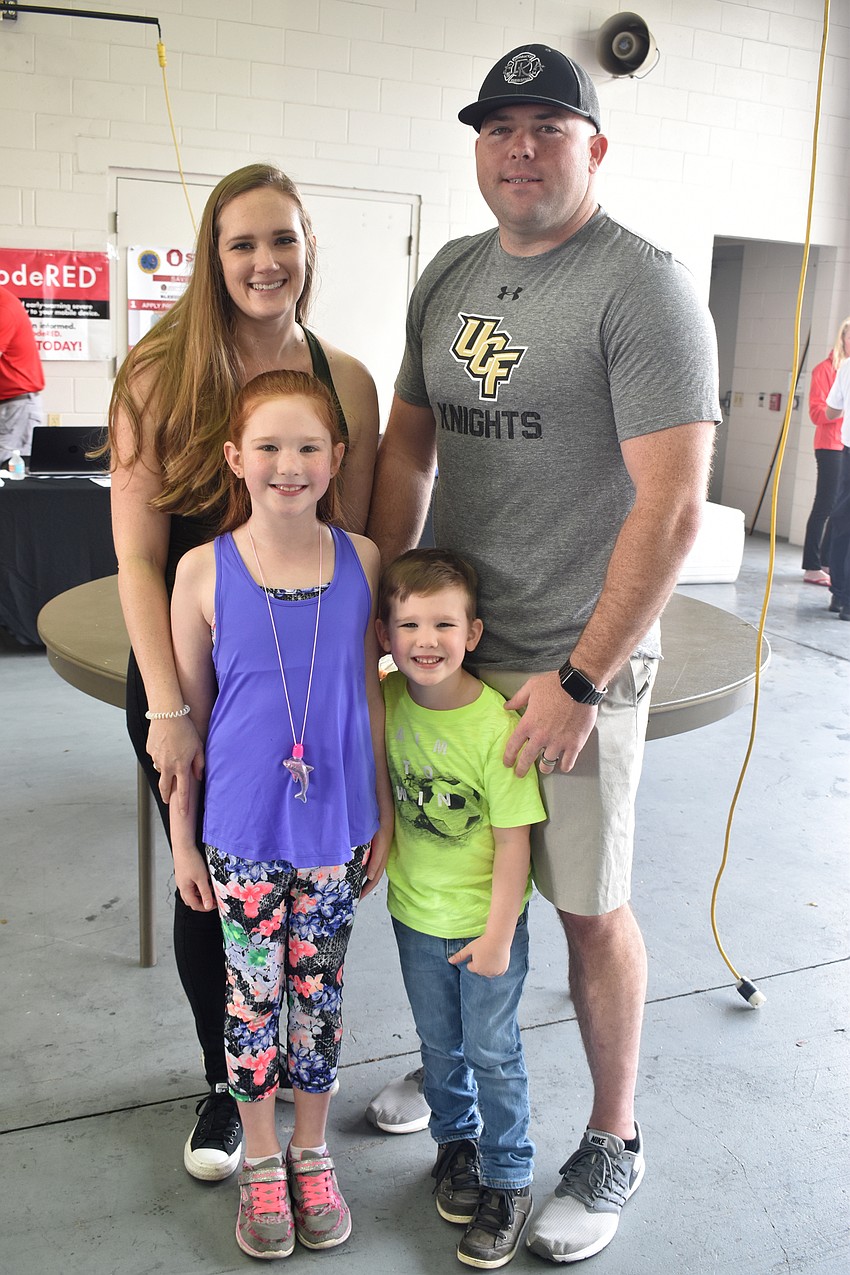 Tori, Olivia, Anderson and Bryan Carr, a lieutenant with the Longboat Key Fire Rescue