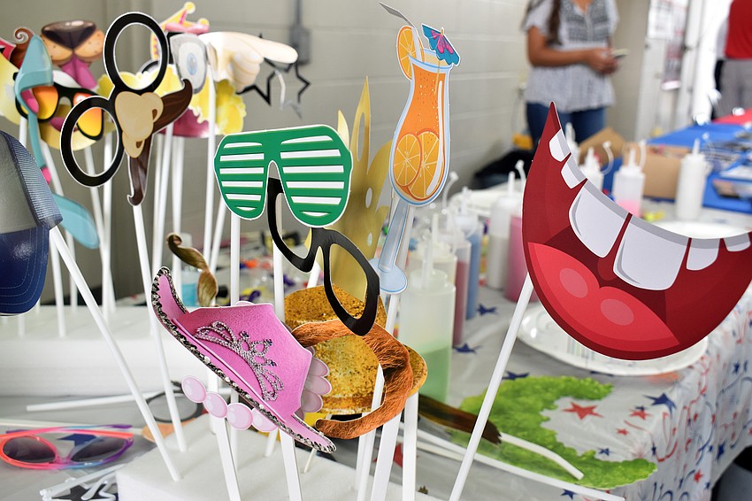 Open house guests could pose with props in a photo booth.