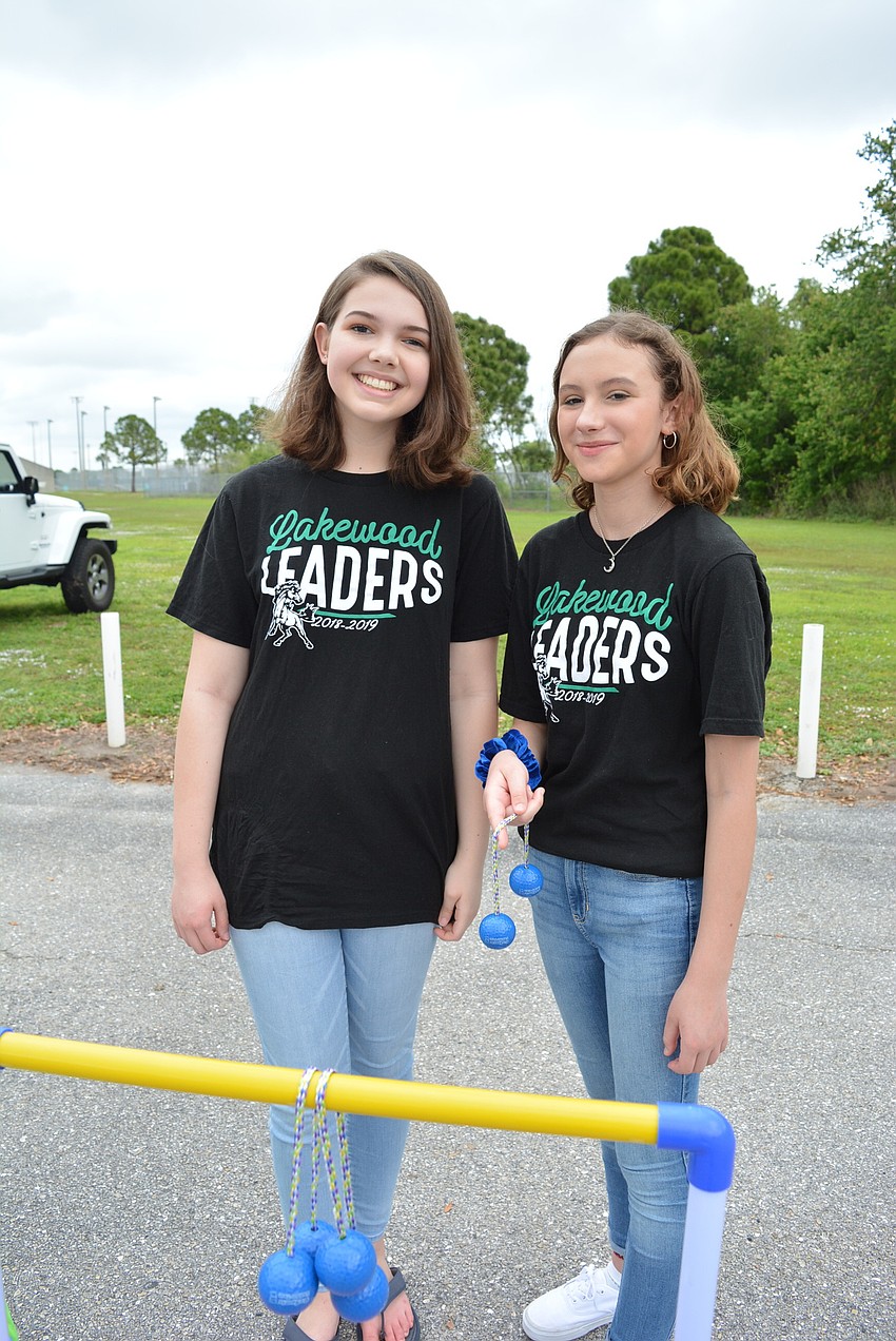 Freshmen Alyssa Hamende and Emilia Simeone volunteer with Lakewood Leaders.