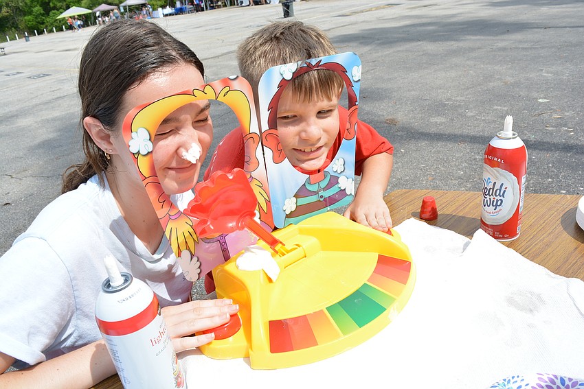 Students for Safety Club member Marissa Briggs, a sophomore, takes a pie in the face for the cause after losing 