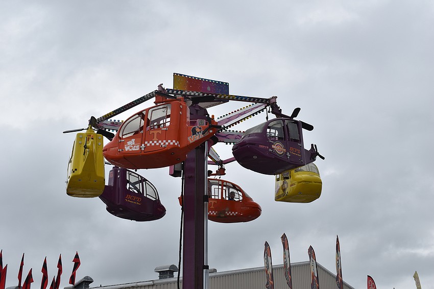 Some of the rides went high up into this sky, like this helicopter shaped one.