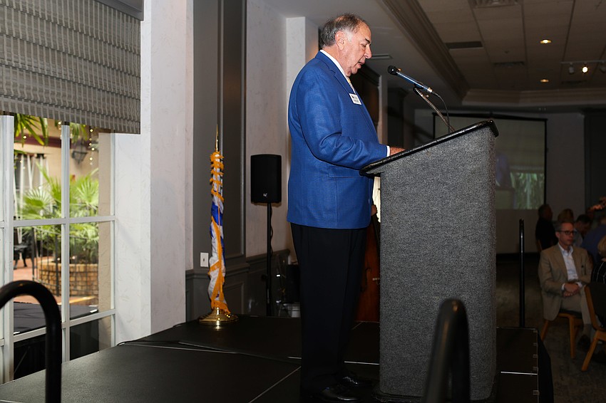 Chairman of the Board Norman Cohen addresses the audience.