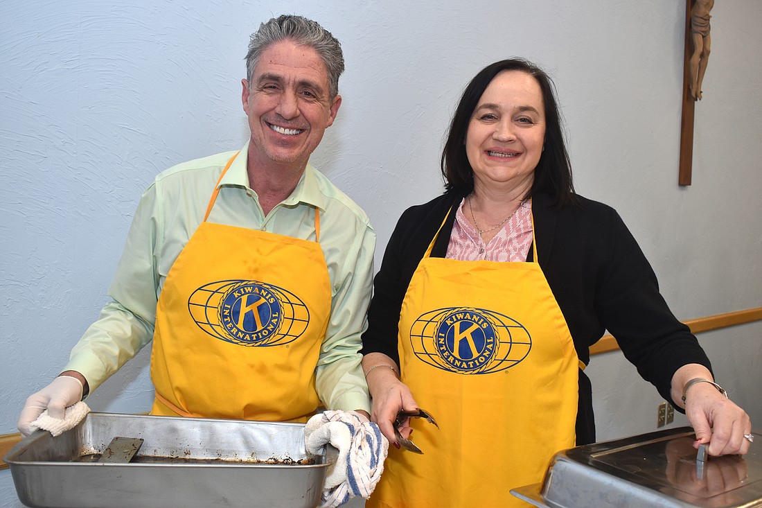 Michael Garey and Asima Palmer served pancakes at last year&#39;s breakfast.