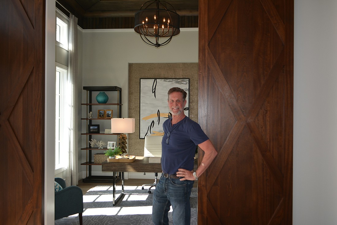 John Cannon is hands-on with every aspect of the building process, such as these barn doors.