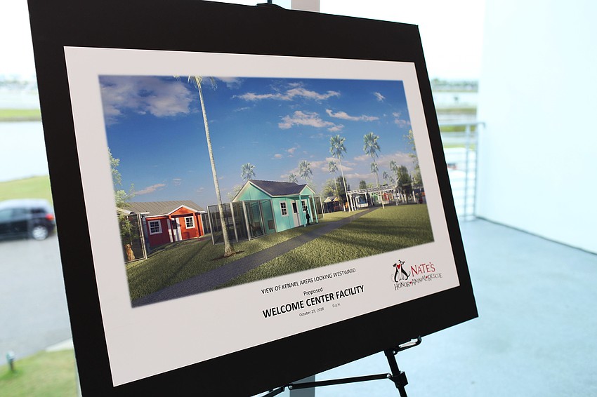 Building plans for the new project were displayed around the room.