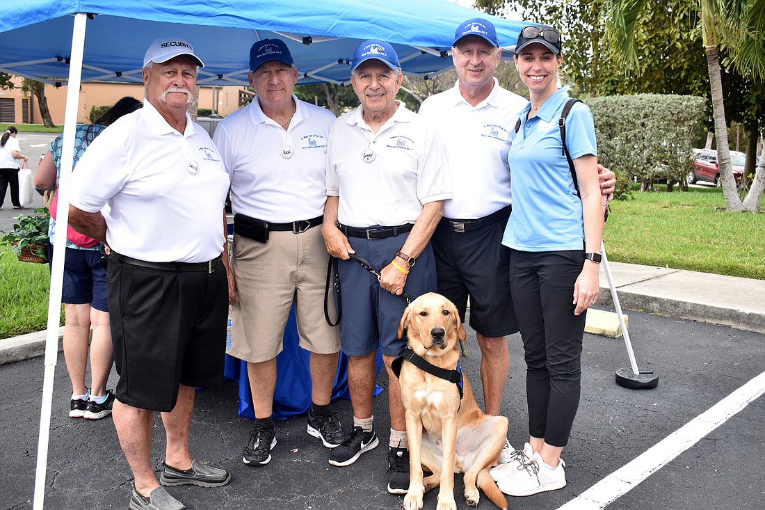 Men&#39;s Club members David Endean, Rick Stauffer, Lenny DiStefano and Chuck Sobieck with Marisa Gerlach of Southeastern Guide Dogs with Astro