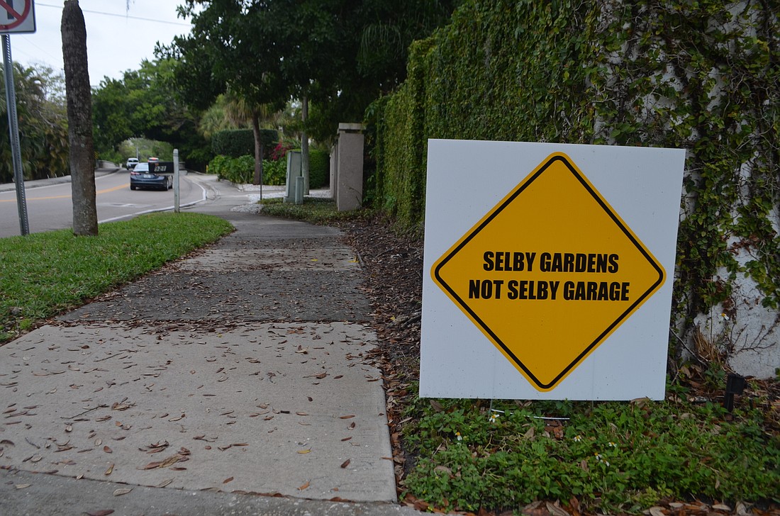 Residents living near Selby Gardens have begun posting yard signs showcasing their opposition to proposed renovations.