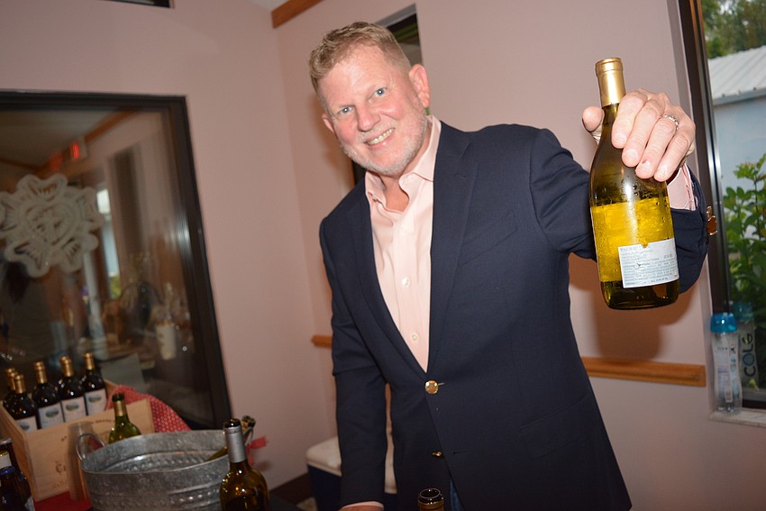 Tony Mullen, husband of preschool director Geri Mullen, serves beer and wine for the ninth consecutive year.