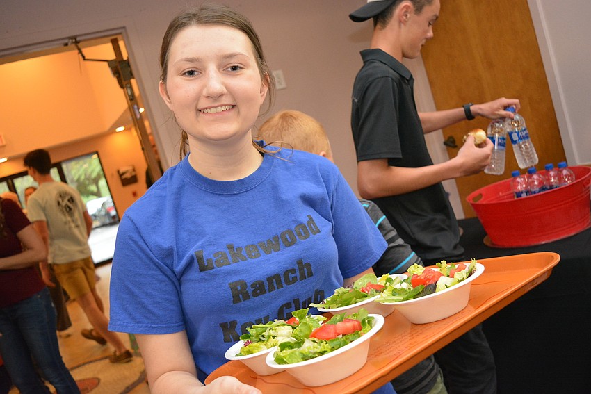 Lakewood Ranch High School Key Club member Mackenzie Sisson volunteers to serve guests.