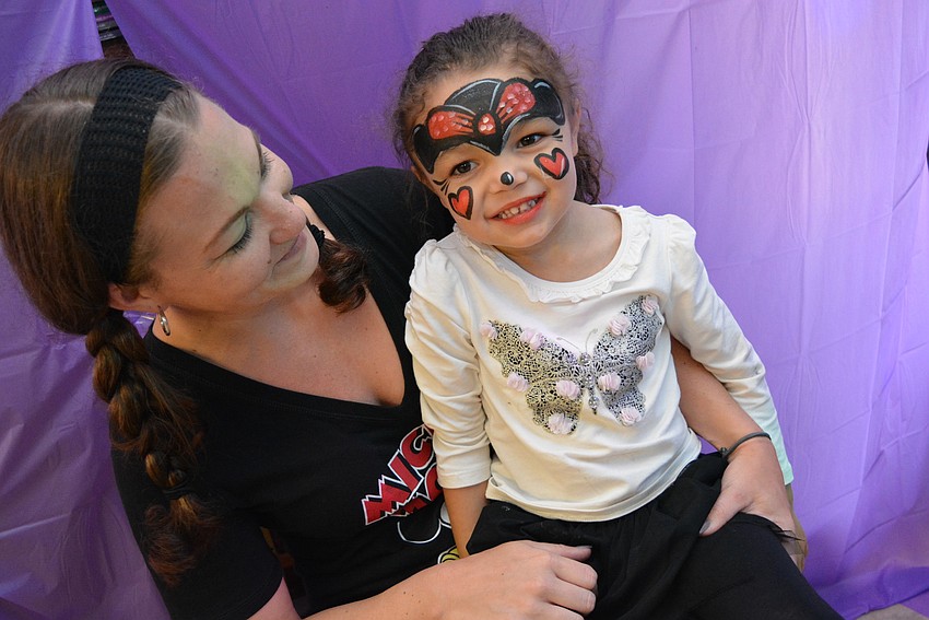 Kaylin Stapchuk has fun playing with Savannah Freer, 3, in the 