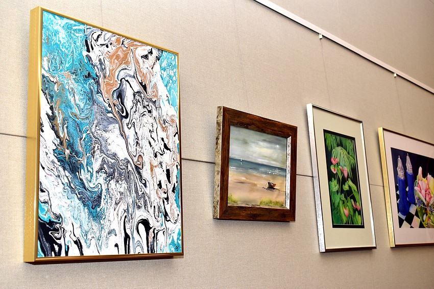 Artwork from 12 local artists hung around town hall for the reception. The pieces will stay there for three months.