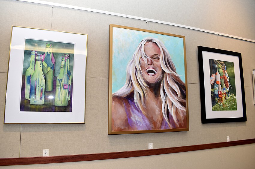 Artwork from 12 local artists hung around town hall for the reception. The pieces will stay there for three months.