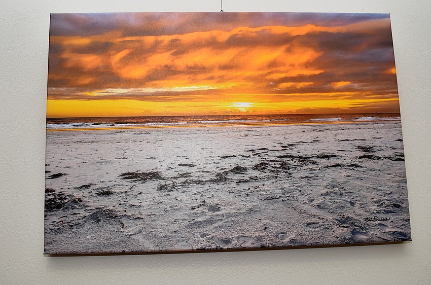 Artwork from 12 local artists hung around town hall for the reception. The pieces will stay there for three months.