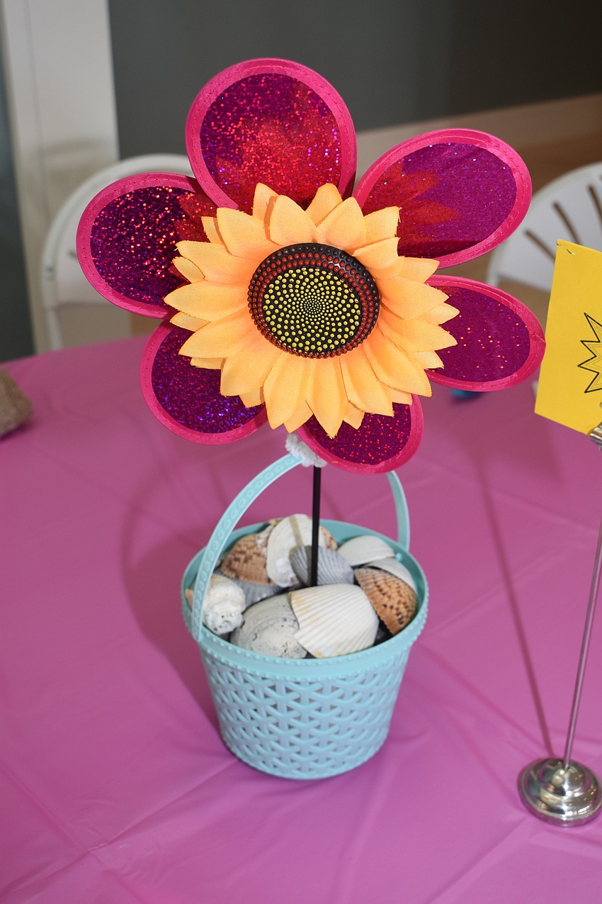 The centerpieces were either pink or yellow to celebrate spring.