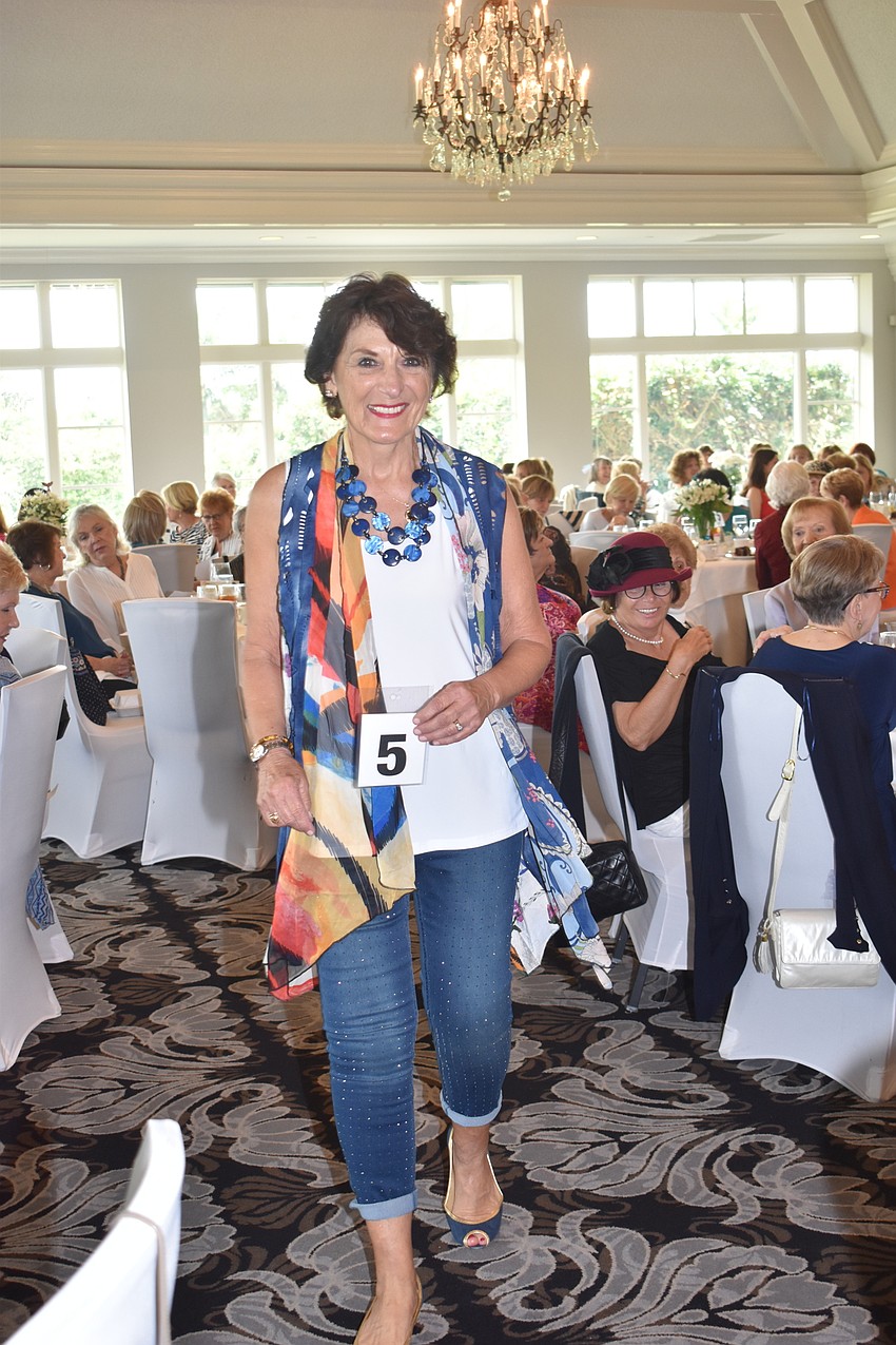 Sharon Holsinger wore a bright vest with her jeans to model.