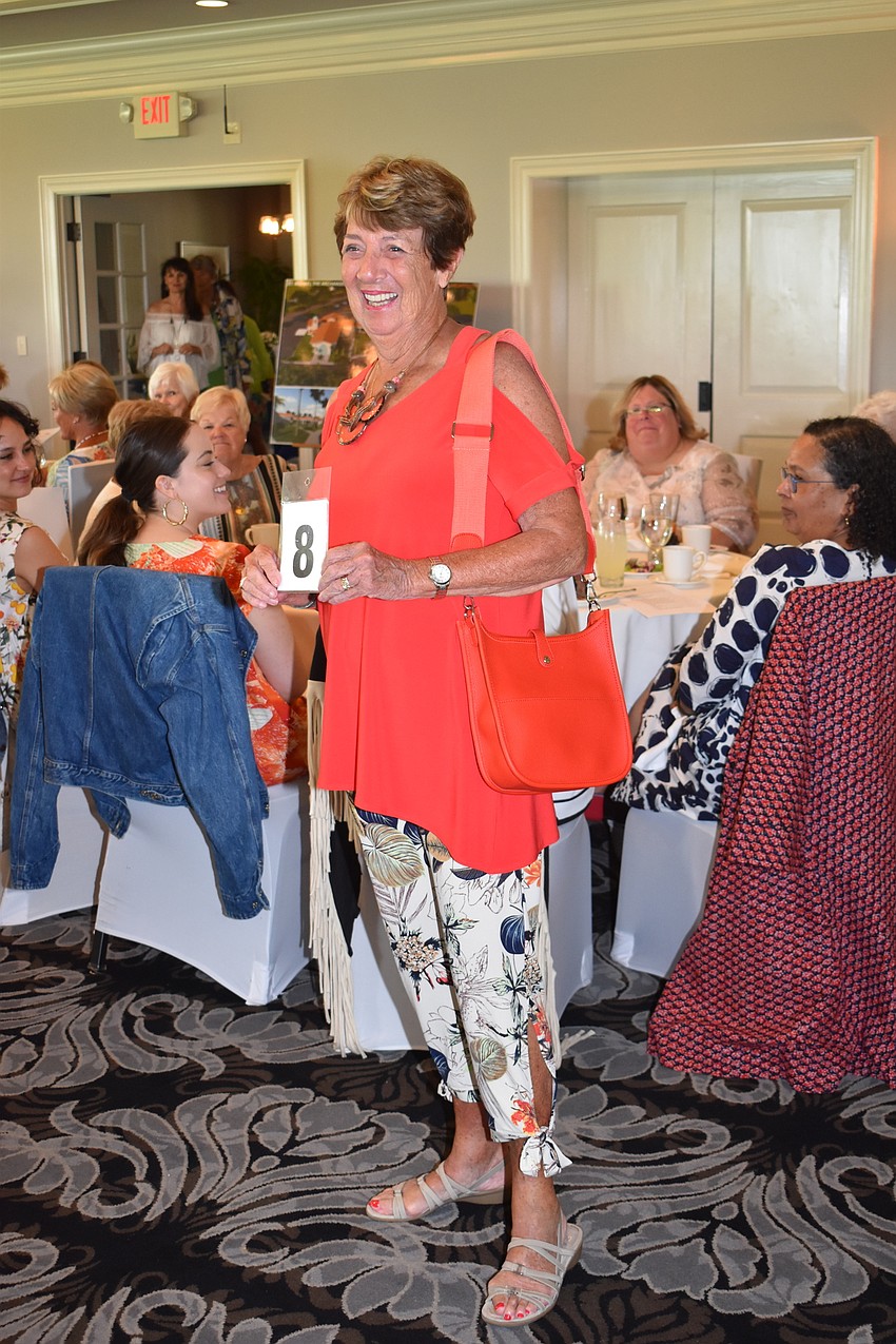 Ruth Galligan matches her purse and her top while she models.