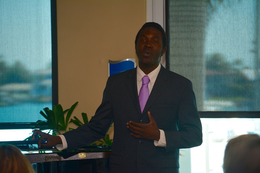Award recipient Melvin D. Bozeman Jr. performs for the luncheon attendees.