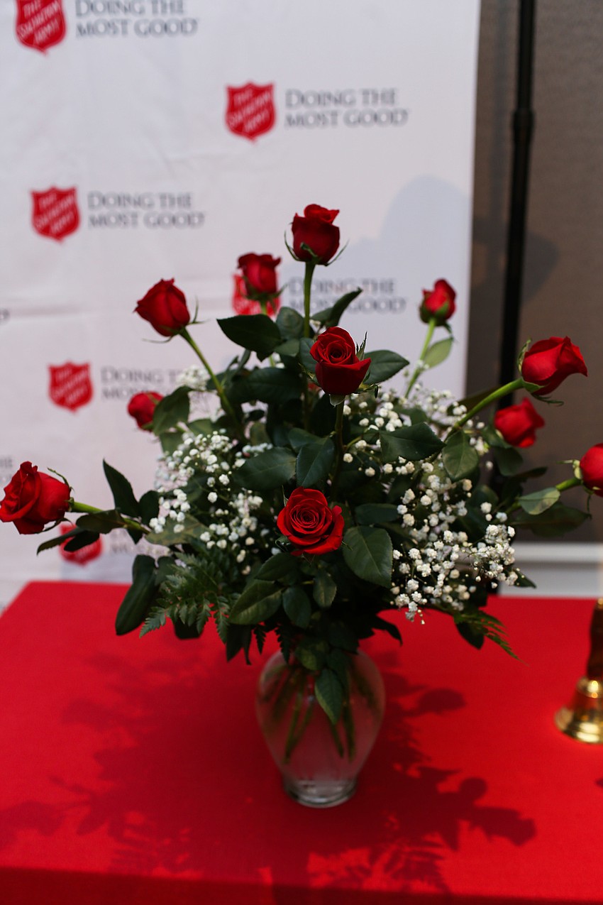 A vase of a dozen red roses was given to the honorees.