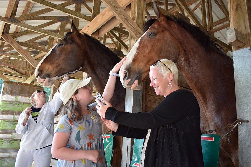 Millie Sica and her mom, Melissa, pet J.D.