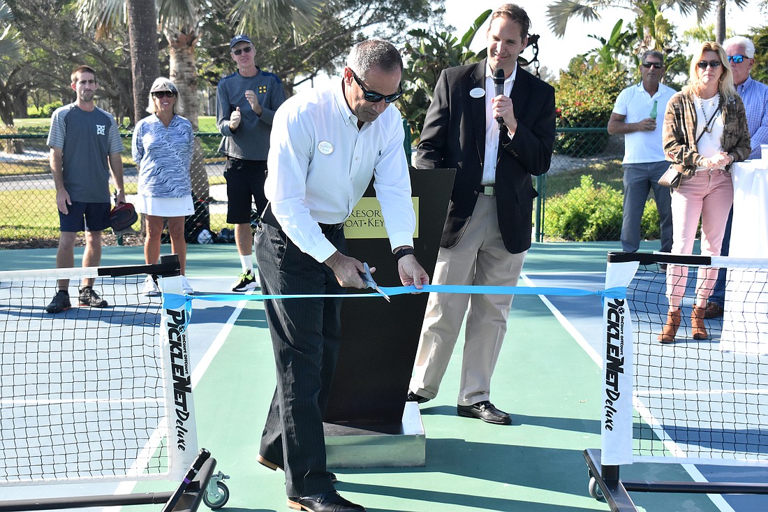 Resort at Longboat Key Club General Manager Jeff Mayers cuts the ribbon on the pickleball courts.