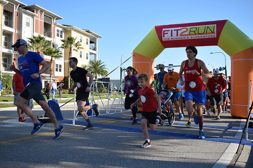 At the sound of the horn, the Beer Belly 5k began, and runners dashed from the starting line.