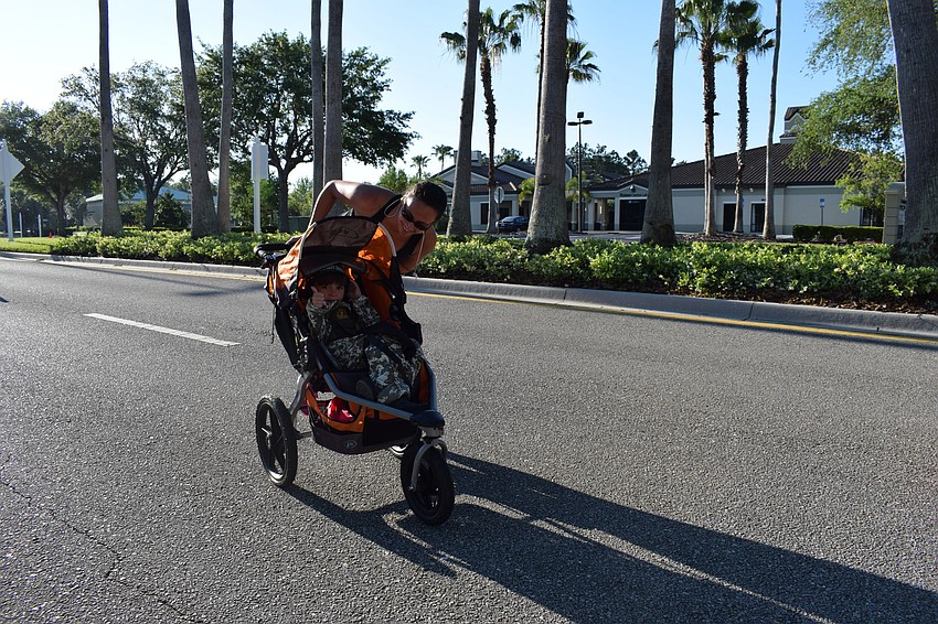 Trish West, of Mallory Park, pushed her son Spencer Diorides, 7, during the race.