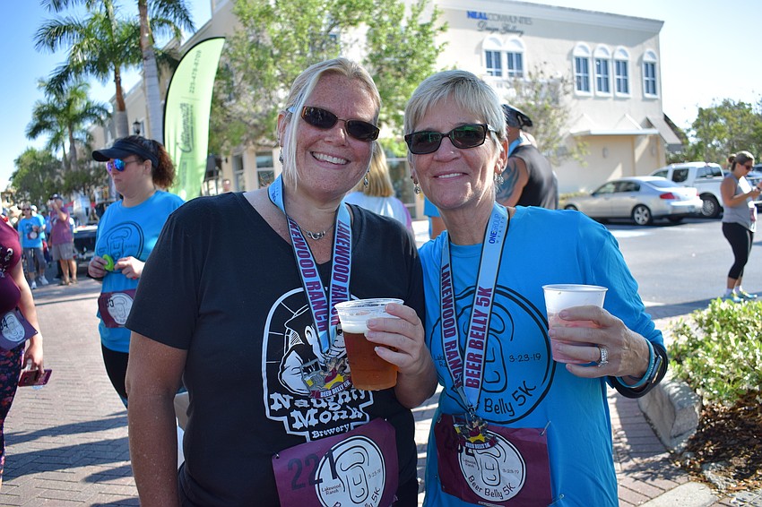 Jen Corn and Beth Swift of Parrish received medals for completing the race.