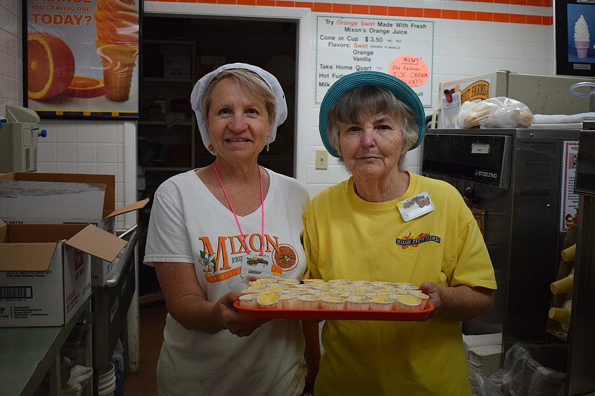 Dianna Mixon and Debbie Granzow offered samples of mango milkshakes.